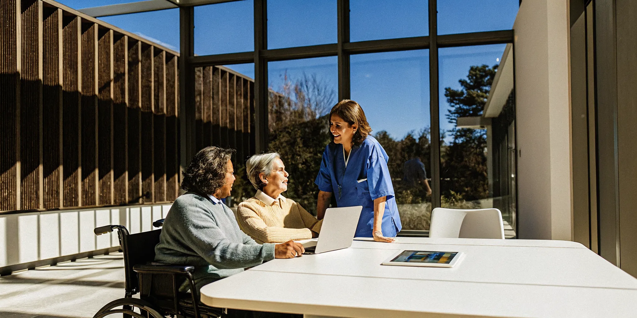A care manager discusses special needs plan care management with an older couple.