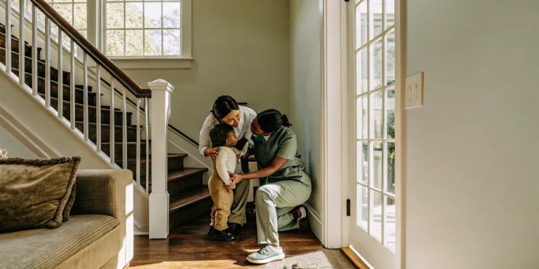 Pediatric nurse supporting a child and parent at home in Georgia
